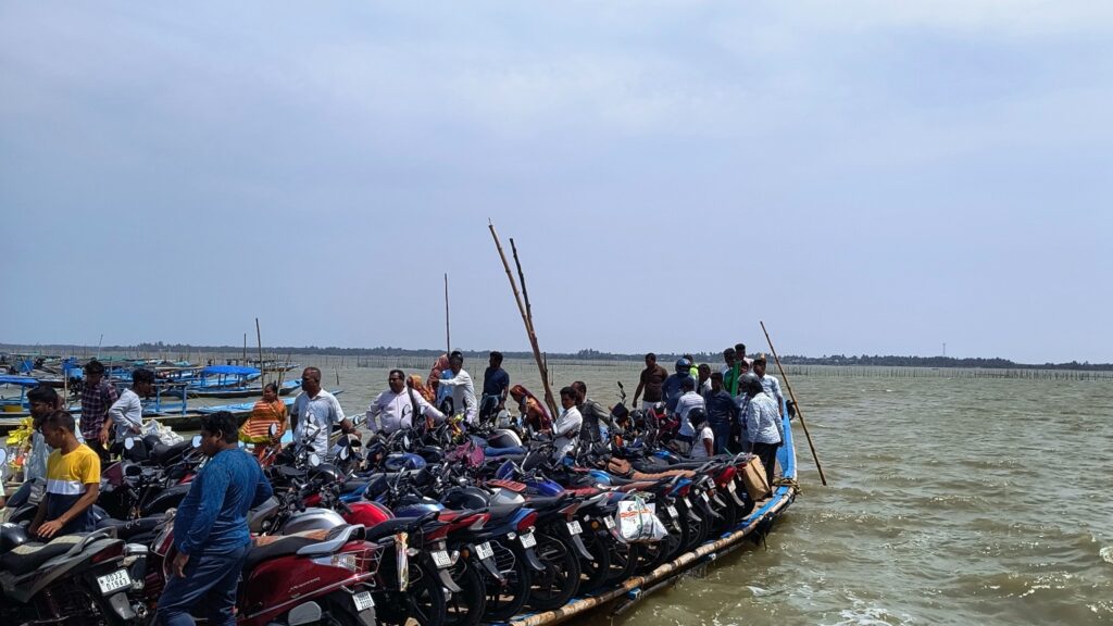 atpada-chilika-lake-bike-ferry.jpg Motorcycles and people crossing Chilika Lake by ferry boat at Satpada in Odisha