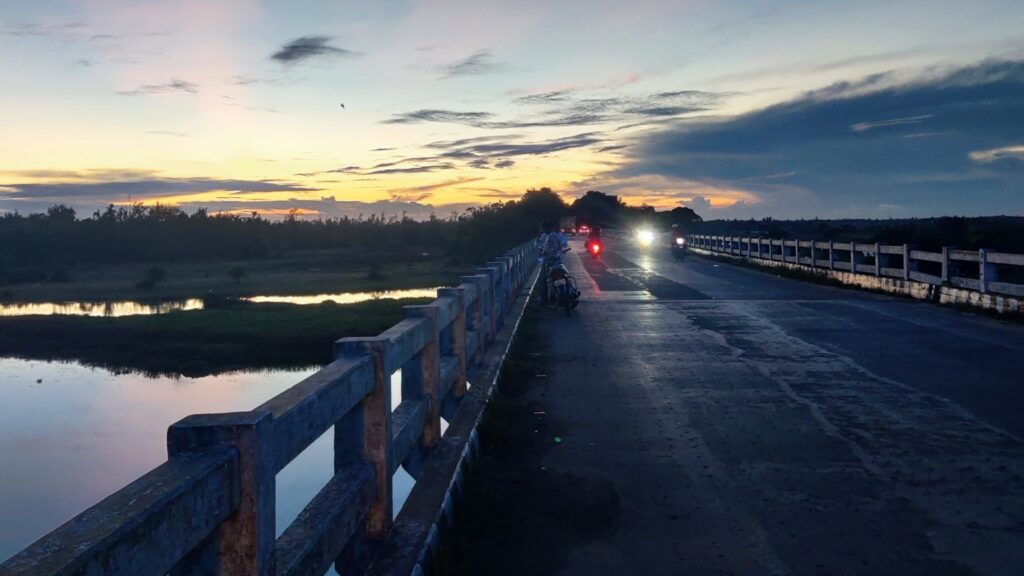 konark-to-puri-evening-road.jpg Evening road view on the Konark to Puri marine drive with sunset sky and bridge