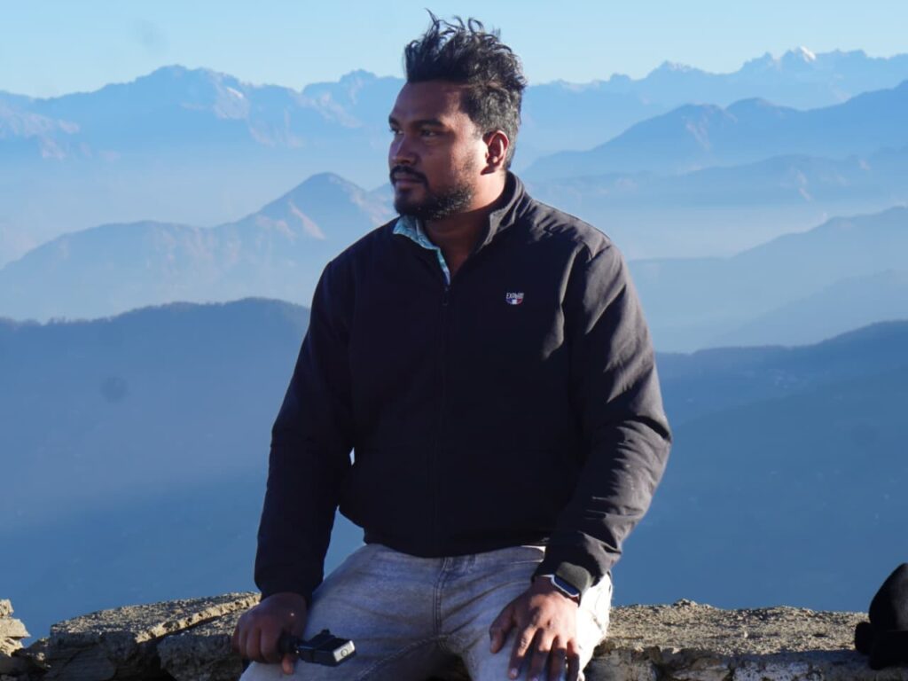 Travel blogger Lohit enjoying mountain view during travel journey